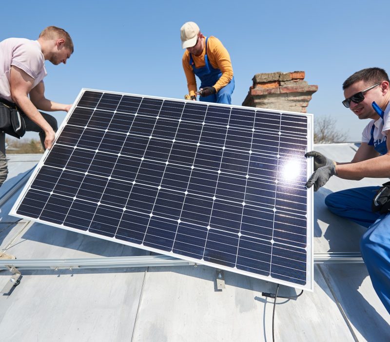 installing-solar-photovoltaic-panel-system-on-roof-of-house.jpg
